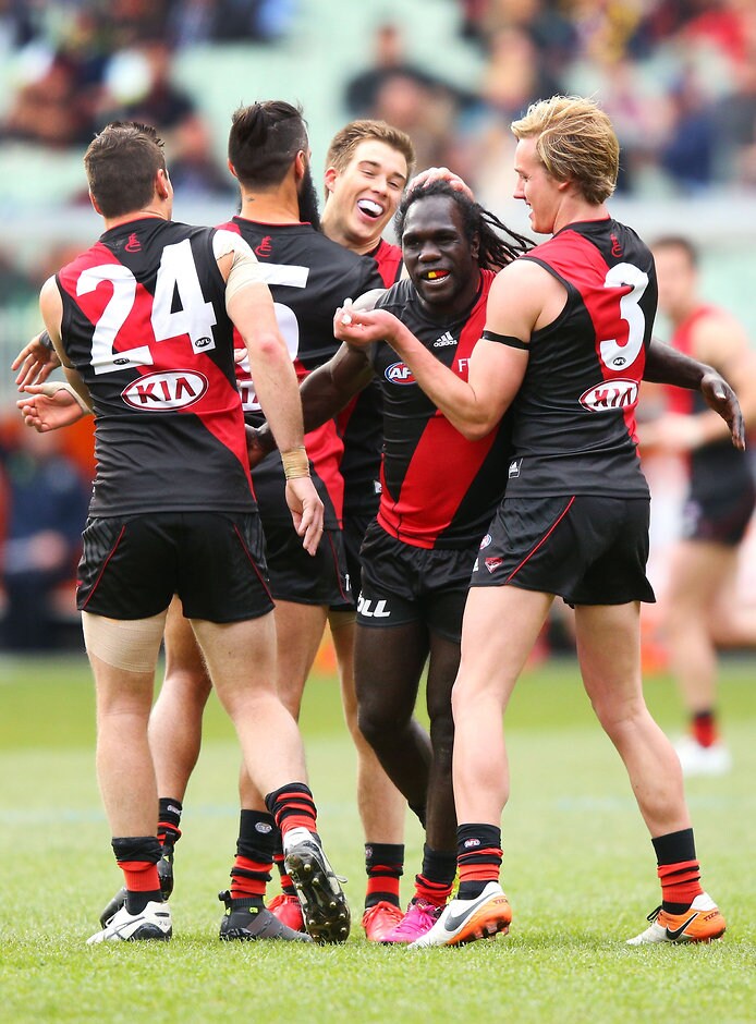 AFL 2016 Rd 23 - Essendon v Carlton MELBOURNE, AUSTRALIA - AUGUST 27: Anthony McDonald-Tipungwuti of the Bombers celebrates a goal during the 2016 AFL Round 23 match between the Essendon Bombers and the Carlton Blues at the Melbourne Cricket Ground on August 27, 2016 in Melbourne, Australia. (Photo by Michael Dodge/AFL Media)